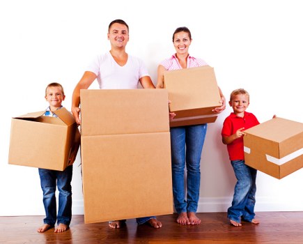 Packed boxes and furniture ready for removal in a Balham flat