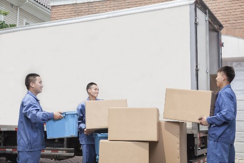 Careful loading of office furniture during a Balham collection
