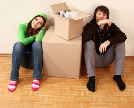 Packed moving boxes and furniture ready for collection